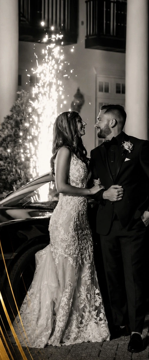 A couple celebrating their wedding beside sparkling lights